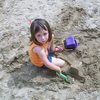 A Little Angel playing in the sand